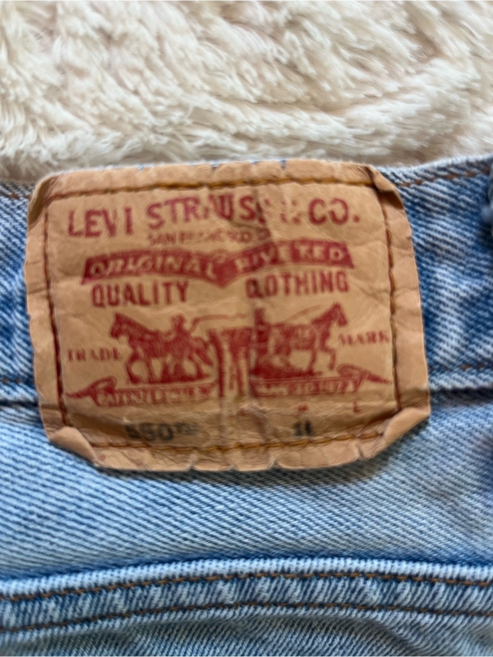 Vintage Levi's Light Wash Blue Denim Jeans with Brown Stitching